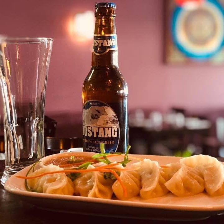 The Mustang Nepalese Restaurant & Bar logo